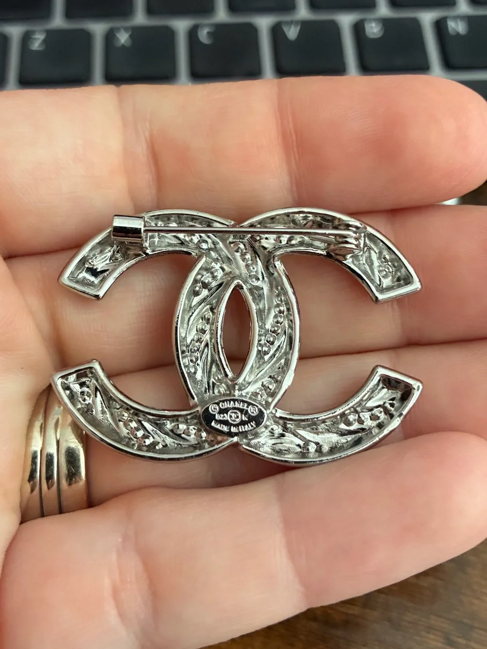 Silver Tone Interlocking Logo Brooch with Crystal Accents